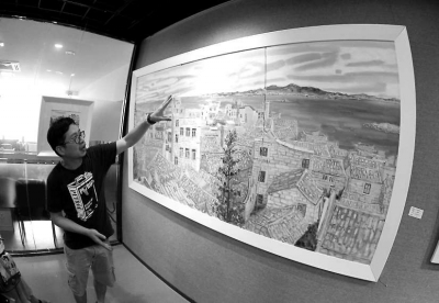 黃瑾毅向記者介紹《海島漁村》。